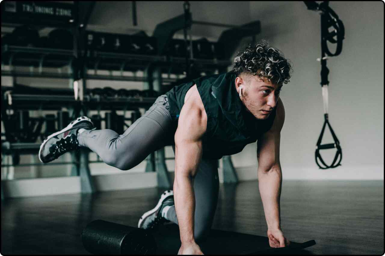 Man stretching his legs before a workout.